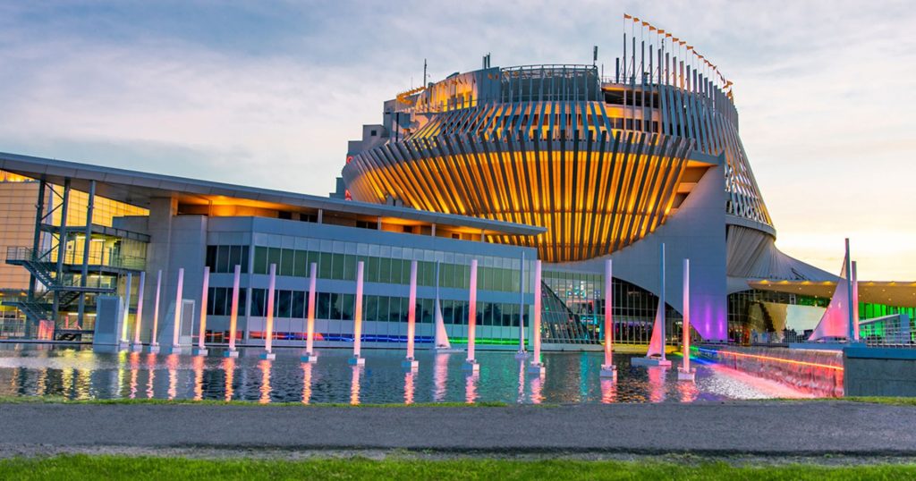 Casino de Montréal in Quebec at dusk, showcasing its unique architecture, illuminated fountains, and modern design.