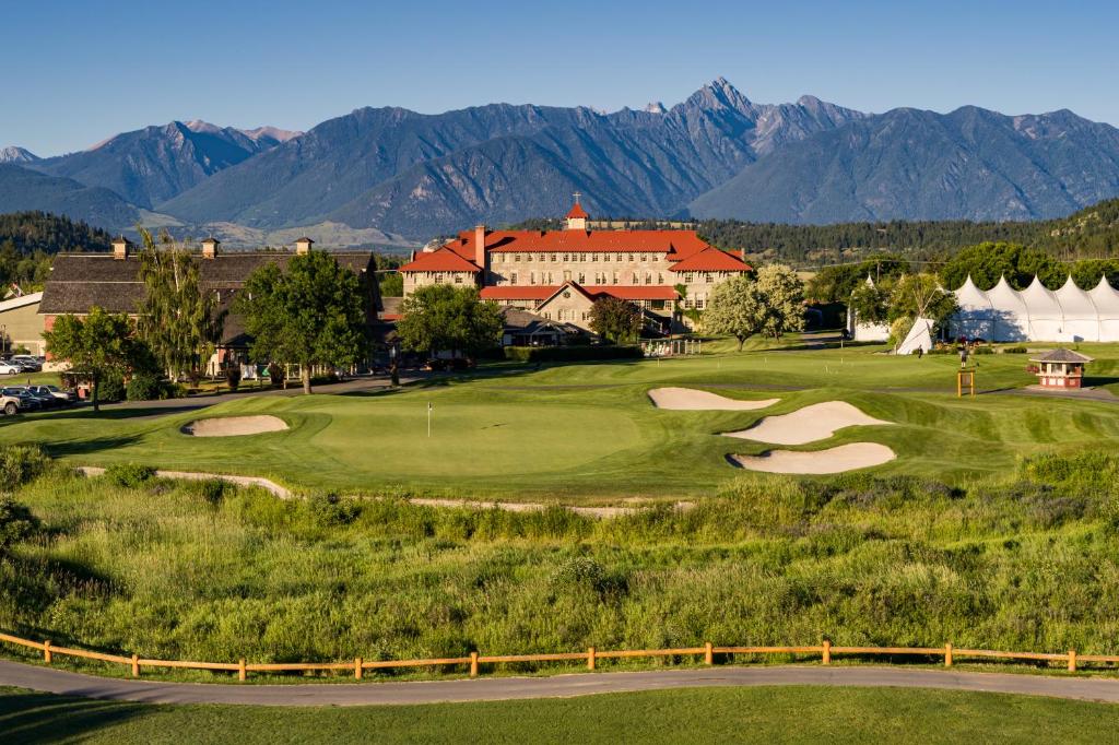 St. Eugene Golf Resort & Casino in British Columbia, nestled amidst lush green landscapes and framed by the majestic Rocky Mountains.