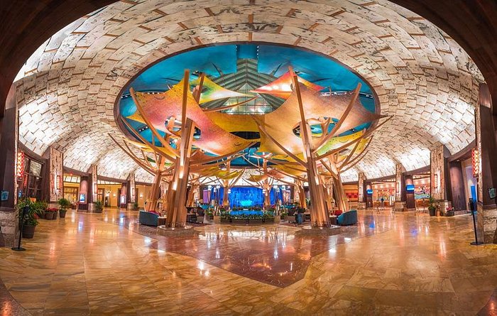 "Mohegan Sun's vibrant interior featuring its unique and colorful ceiling design, located in Uncasville, Connecticut."