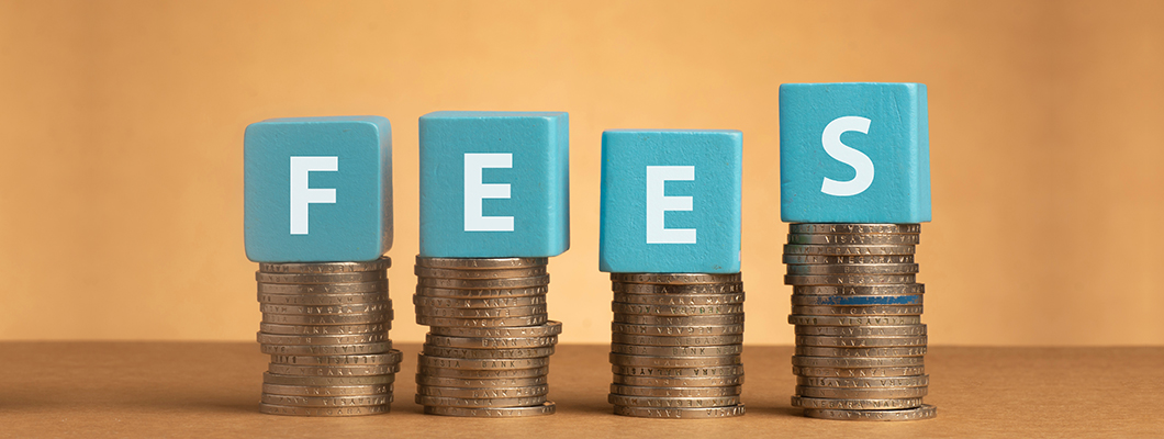  Stacked coins with "FEES" blocks representing tuition costs and fee structure for fashion designing courses at various levels.